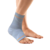 Ankle support with sillcone pressure pad